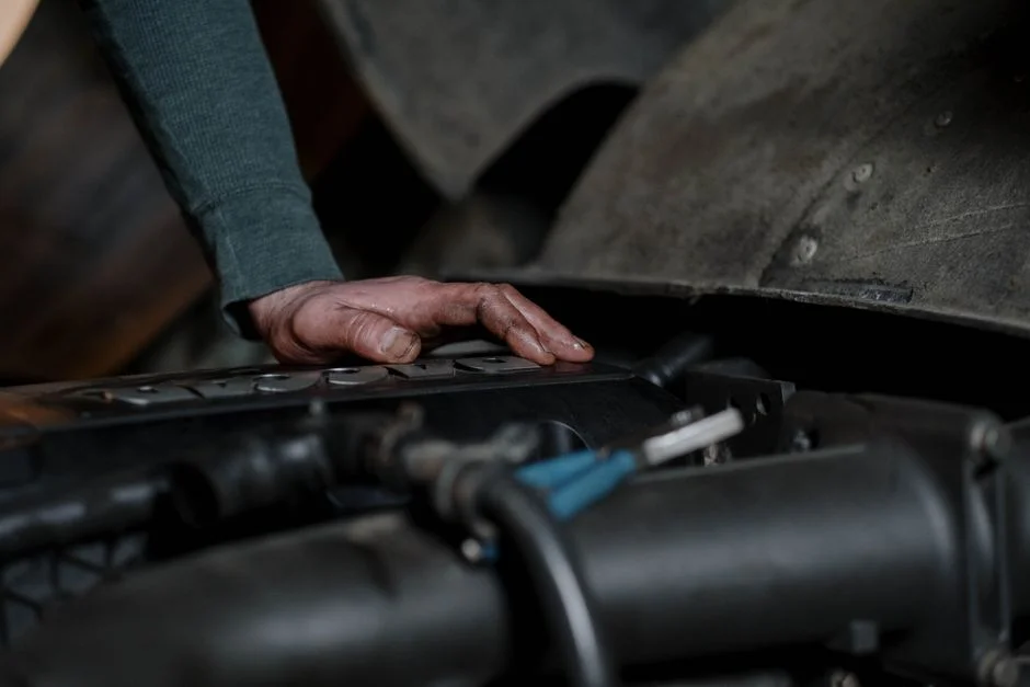 Professional mechanic working on a car engine